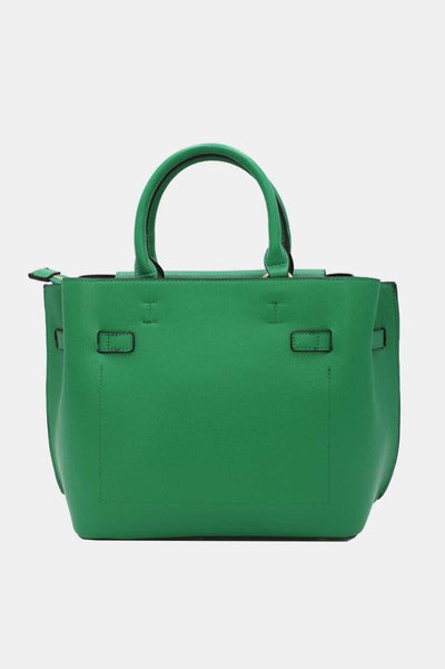Håndtaske med dekorativ lås. Grøn